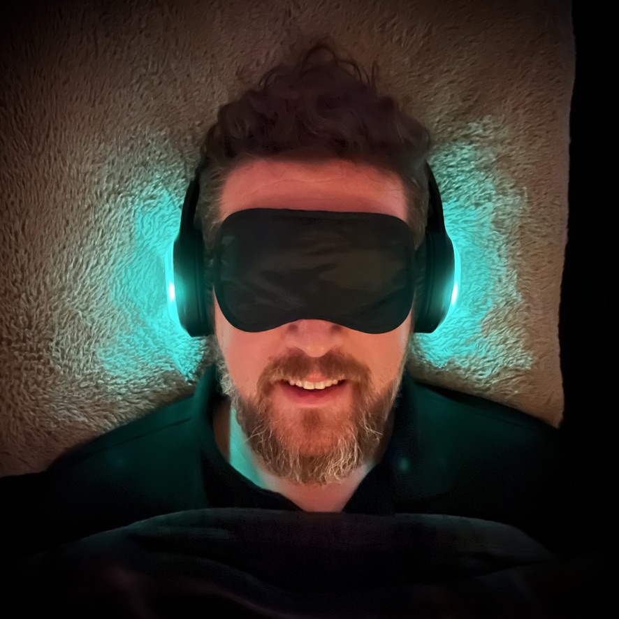Breather resting in eye mask and headphones
