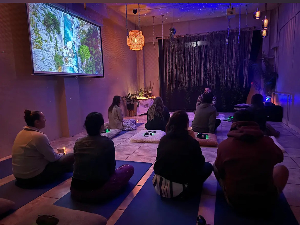 Group breathwork circle at Sacred Zenith